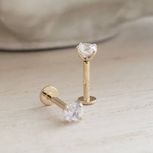 Pair of 14 karat gold and Diamond CZ push in style flat back studs.