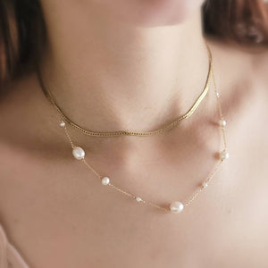 Multi white pearl station necklace on model with brown hair - By Studio Blue