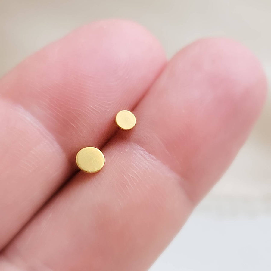 Flat back Dot Studs, Screw in flat back earrings in 14K Gold plated Surgical Steel. Available in 2 sizes, 3mm & 4mm between 2 fingers, by Studio Blue on Etsy