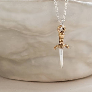 Tiny dagger charm necklace in Sterling silver with Bronze accent on a delicate silver chain by Studio Blue on Etsy.