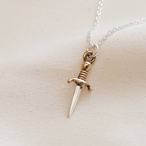 Tiny dagger charm necklace in Sterling silver with Bronze accent on a delicate silver chain by Studio Blue on Etsy.