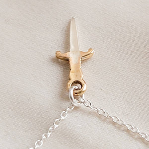 Tiny dagger charm necklace in Sterling silver with Bronze accent on a delicate silver chain by Studio Blue on Etsy.