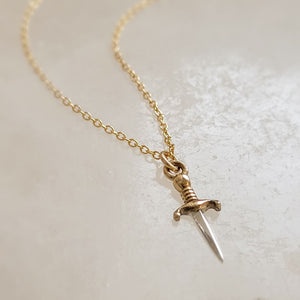 Tiny dagger charm necklace in Sterling silver with Bronze accent on a delicate 14k gold fill chain by Studio Blue on Etsy.