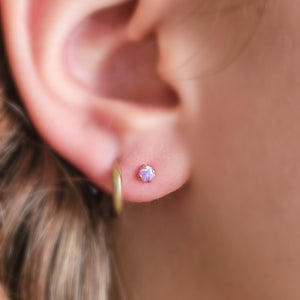 Opal flat back studs. 14K gold plated 316L Surgical Steel, push in style in purple, on model by Studio Blue on Etsy