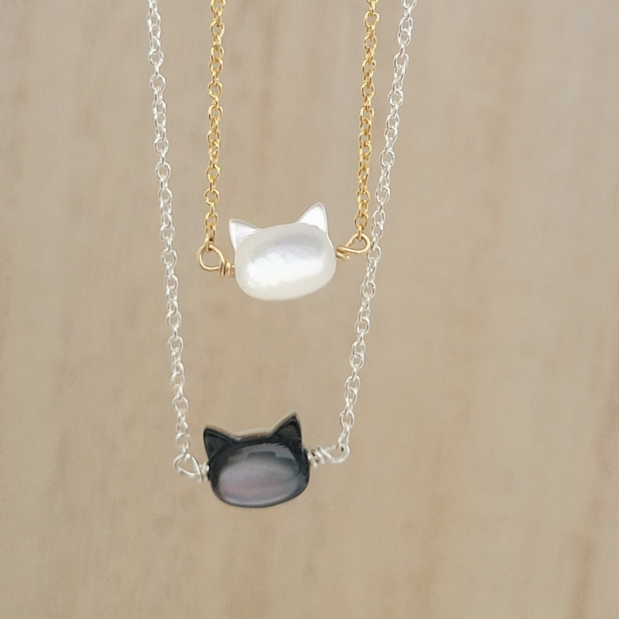 Mother of Pearl cat necklace. White or Black Mother of Pearl carved cat charm on delicate chain, sterling silver and 14k gold fill, by Studio Blue on Etsy