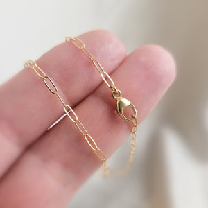 Dainty paperclip link chain necklace in 14k gold fill with lobster clasp, shown on two fingers. By Studio Blue on Etsy