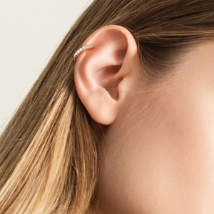 Blonde model with one gold pave hoop in cartilage