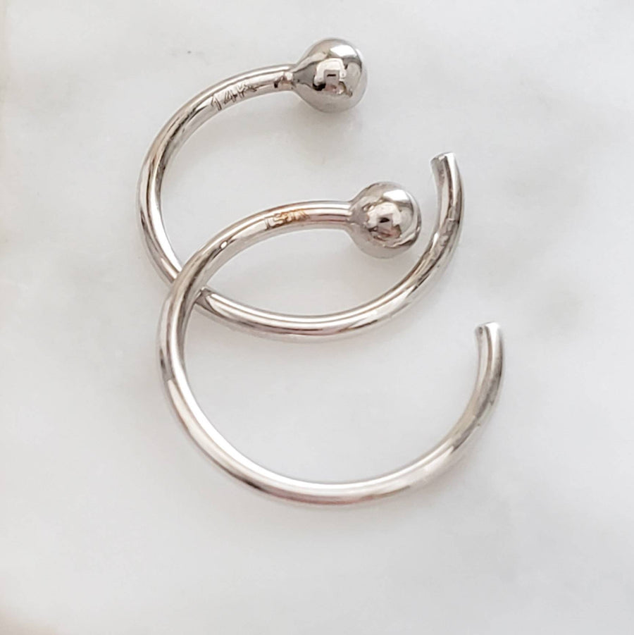 White gold open huggie hoops with 2mm ball beads on white background
